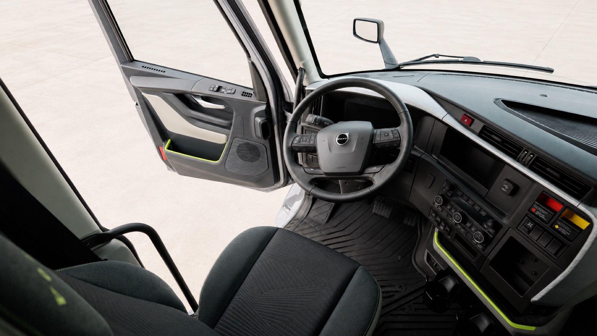 Driver seat, wheel and open door of the new Volvo VNL